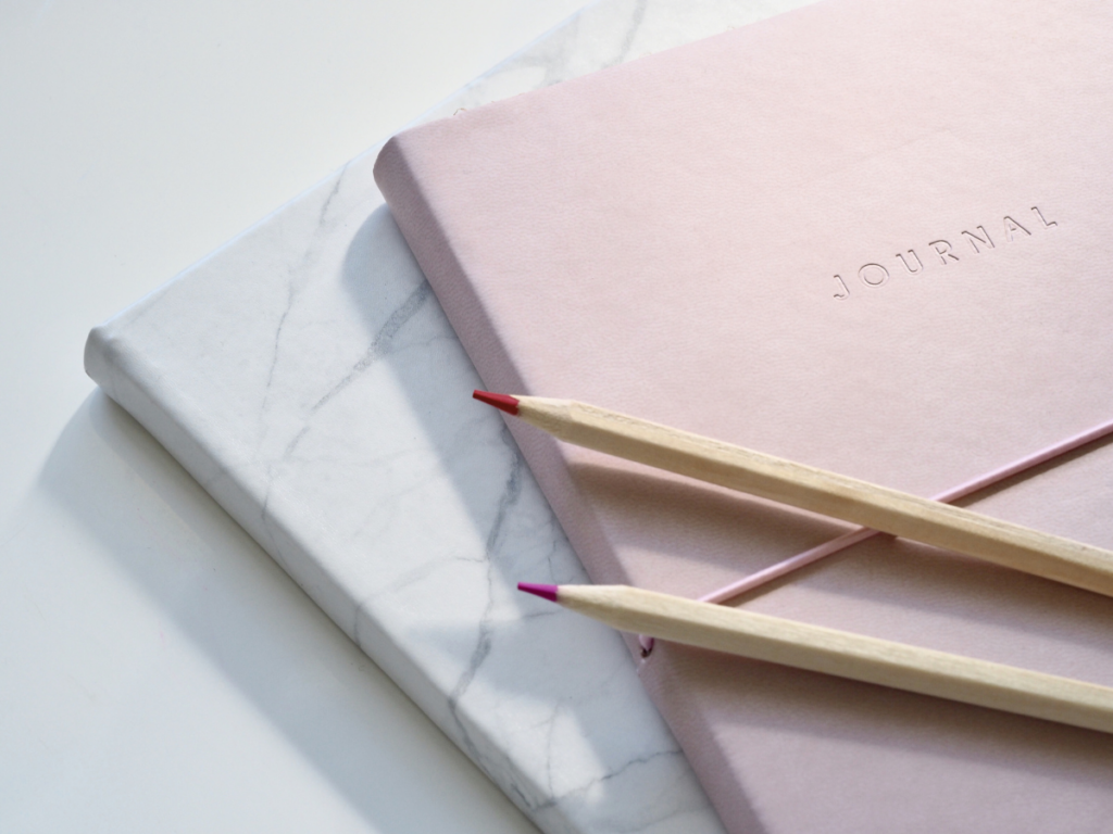 Notebook with pencils for journaling