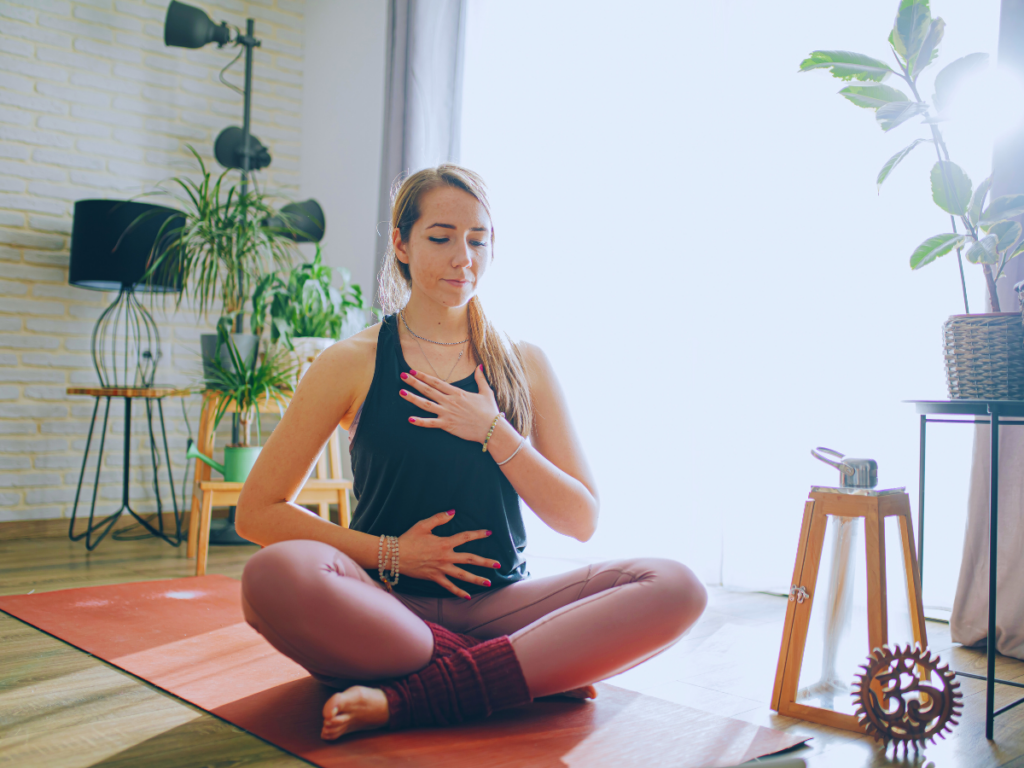 Person practicing mindful breathing with eyes closed